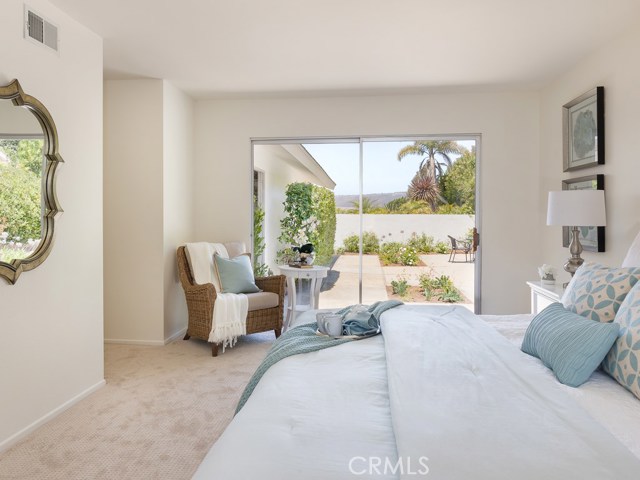 Master bedroom with glass slider to back patio, grand views of hills and canyons.