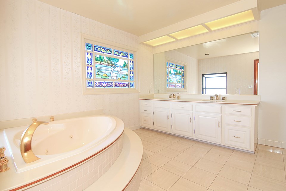 Master Bathroom with Jacuzzi Bathtub overlooking Catalina Island and Stained Window