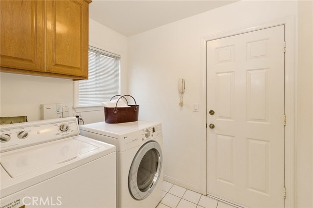 Laundry room adjacent to the Garage and downstairs two bedrooms. 
Bright and spacious with side by side and linen closet.