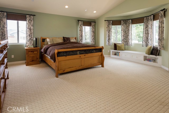 Oversized master suite with built in bench, fireplace and walk-in closet.