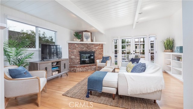 Living room with french doors to deck  and yard