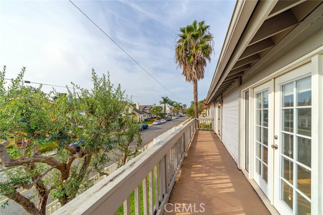 Front bedrooms both open onto a large balcony that runs the full length of the home. Great for extra breeze and light, and excellent for curb appeal.