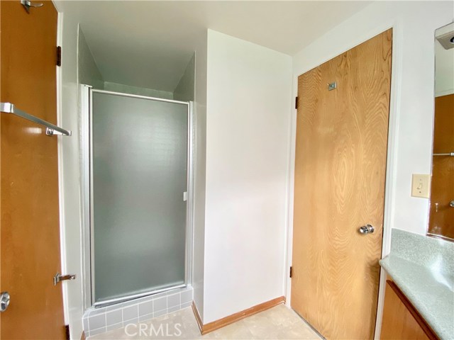 Shower in 3/4 Bath off Bedroom #1.  Interior Laundry access door to the left