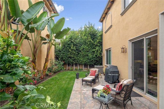 Private Grassy Backyard with Fruit Trees and Flowers