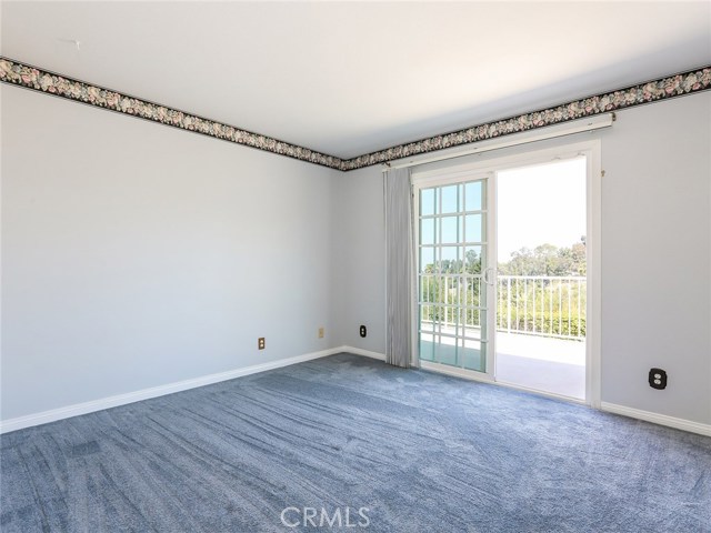 One upstairs bedroom with access to balcony