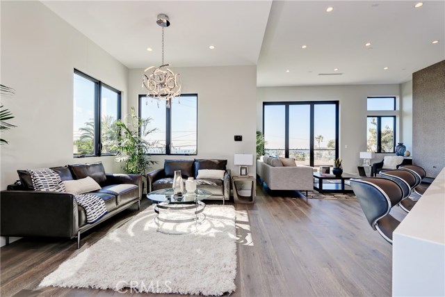 Lounge area leading into family room and kitchen