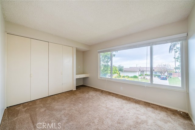 Middle front room with large windows to see the ocean views. Nice built in desk.