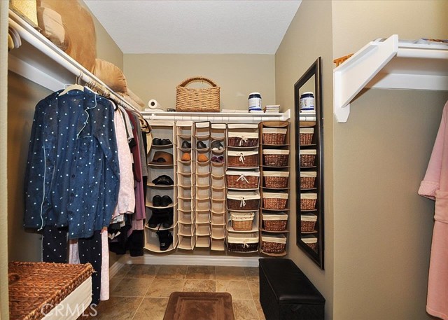 Partial view of master walk-in closet