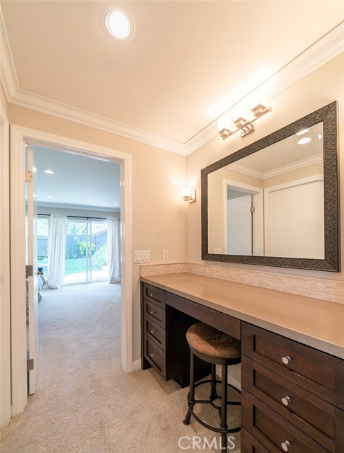 Master bedroom dressing area with built-in vanity.