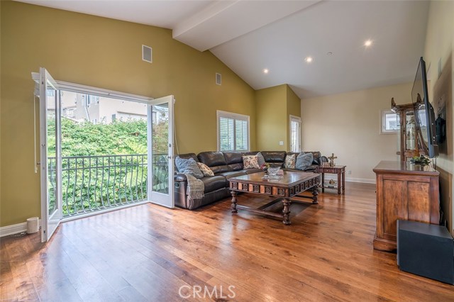 Family room with french doors where you can look down at private backyard