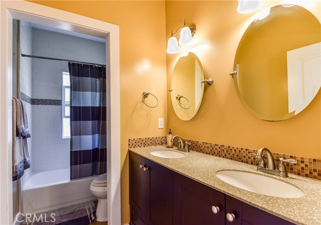 Upstairs bathroom with double sinks