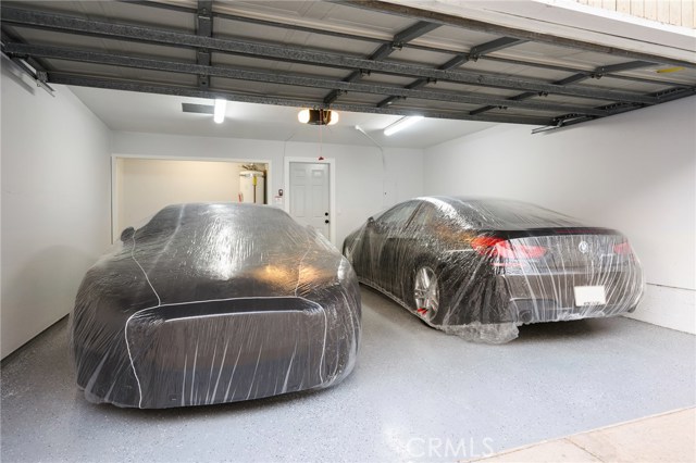 Large attached garage with laundry epoxy floor and new garage door opener.