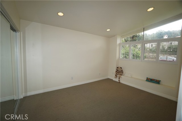 Third bedroom or your office.  High architectural angled ceilings and clerestory windows add space, character, light.