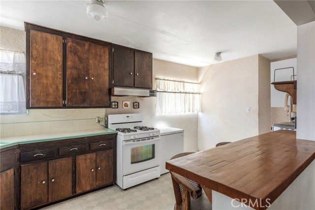 Kitchen is east facing (sunny) and has breakfast bar and nook area.
