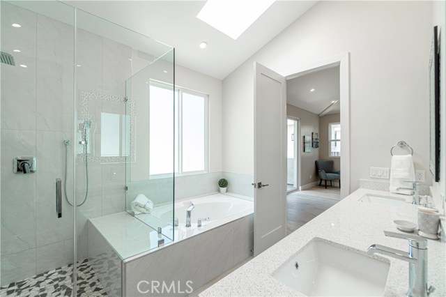 Primary Bathroom with full walk-in shower and jetted hot tub.