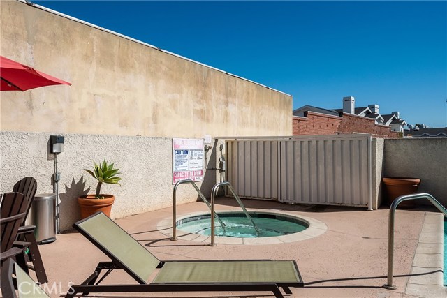 Picnic table, chairs and chaise lounges at the community pool and spa!