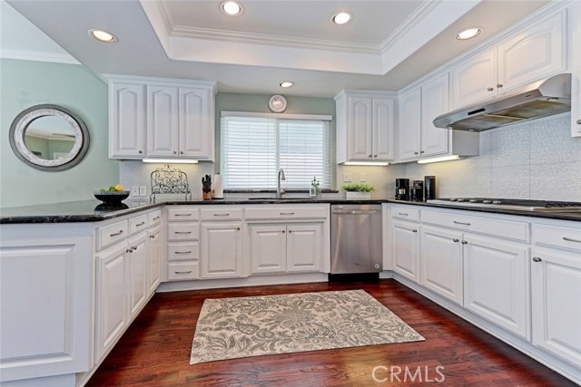 Kitchen Area with Granite Countertops and Stainless Steel Appliances