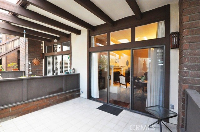 Partial view of the front tiled patio situated off of the Living area. This is one of TWO patios at this property for your enjoyment.