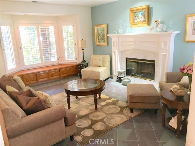 Formal living room with fireplace.