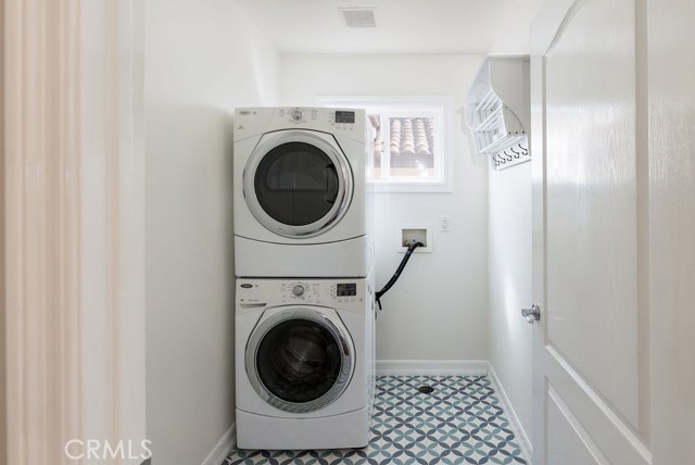 Laundry room with room for extra storage & a closet