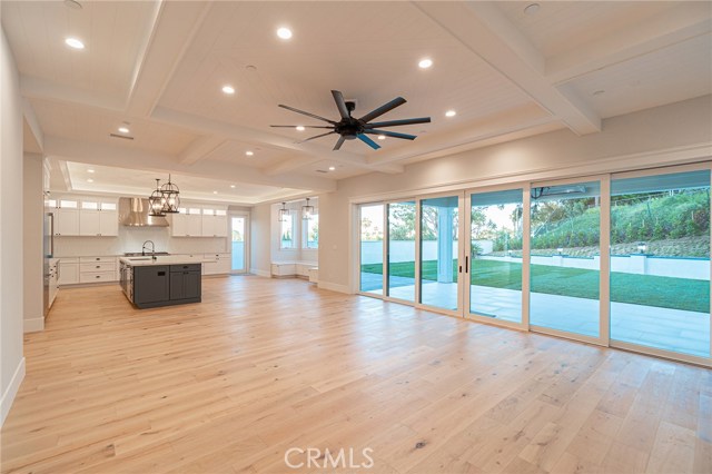 VIew of 20 foot multi-slide doors, covered patio and expansive backyard.