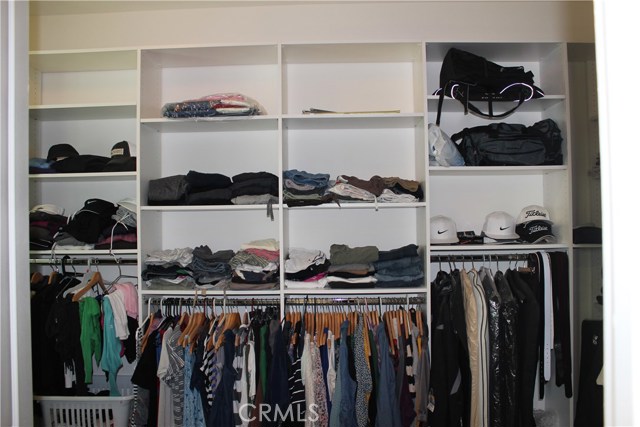 Professional installed closet shelves with an added window on the left (not shown).