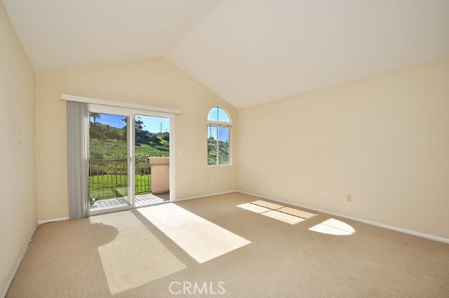 Master bedroom with vaulted ceiling