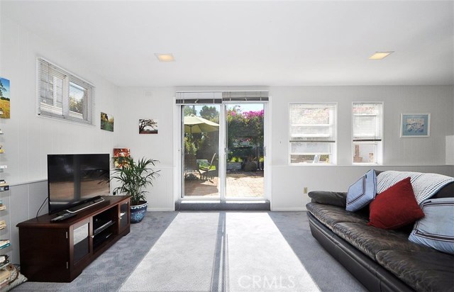 Another view of the family room on the lower level (leading to the backyard)