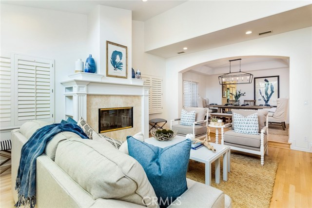 Formal living room with fireplace and plantation shutters