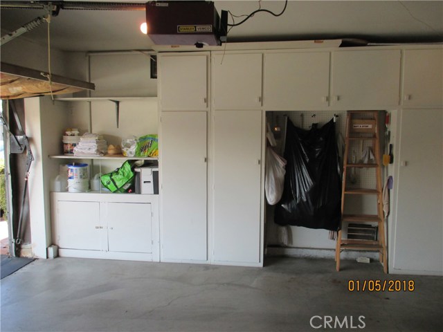 Some of the many storage cabinets in 2-car garage..