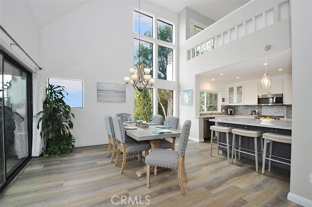 Another view of the dining area, kitchen and the loft