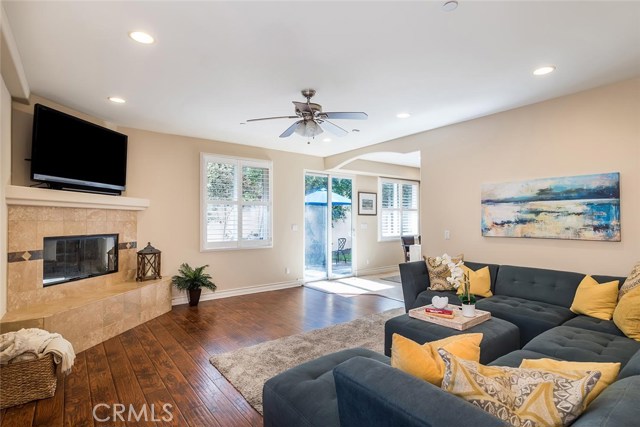 Expansive living room flowing to the kitchen, dining area and backyard/patio.