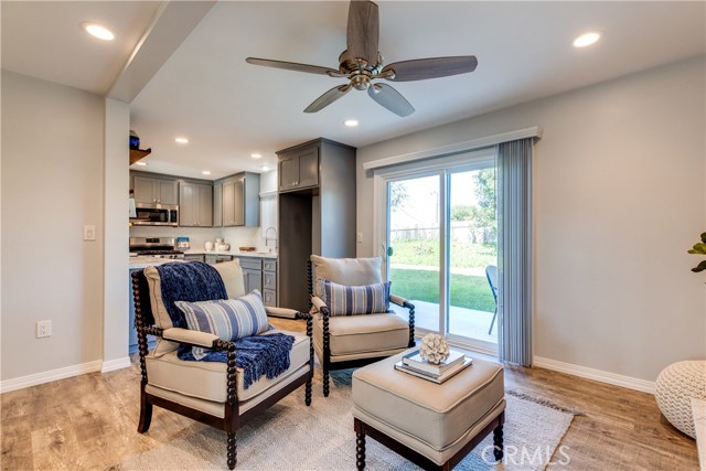 Sliding glass doors open to the spacious backyard with a dining patio for meals al fresco!