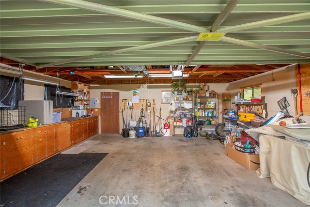 Detached garage with built-in work bench and cabinets.