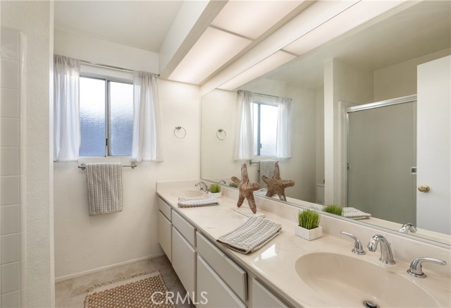 Bedroom with dual sink vanity