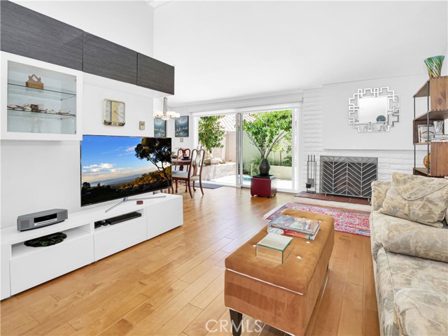 Family room with built-ins, wood burning fireplace, flows to patio and dining area.