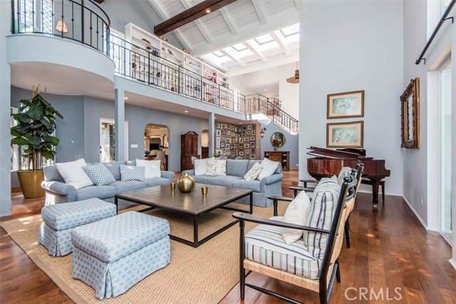 Two Story Ceilings in this Sun Drenched Living Room