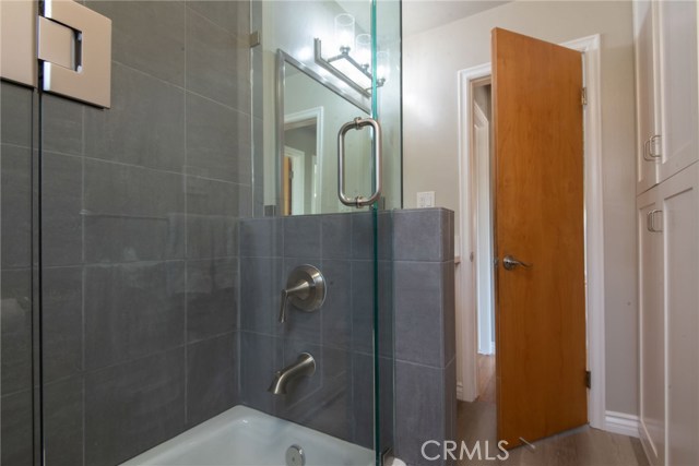 CENTRAL/BACK BATHROOM - FINE ITALIAN PORCELAIN TILE, CAST IRON TUB, FRAME-LESS SHOWER ENCLOSURE, SATIN NICKEL HARDWARE