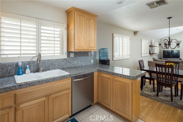 Kitchen with newer dishwasher and granite countertops Kitchen with newer dishwasher and granite countertops