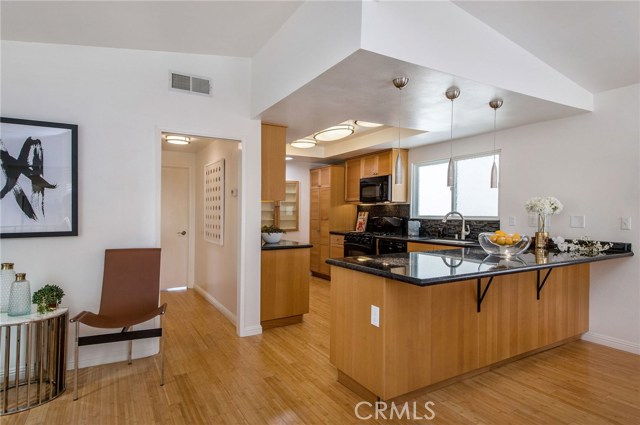 Nooks and areas for dining make this kitchen space the gathering place. Enjoy the ocean breeze while you cook!