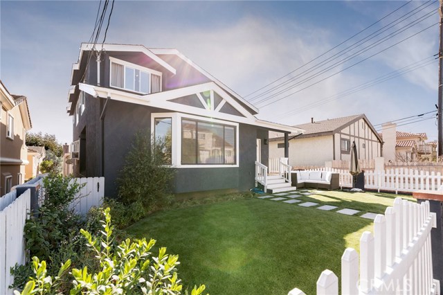 fenced in yard with artificial turf