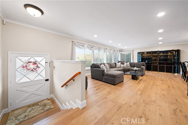 Entry door and large living room with great views of the hills.