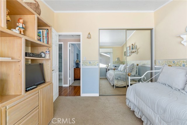 Entertainment Center and Mirrored Wardrobe in Front Bedroom