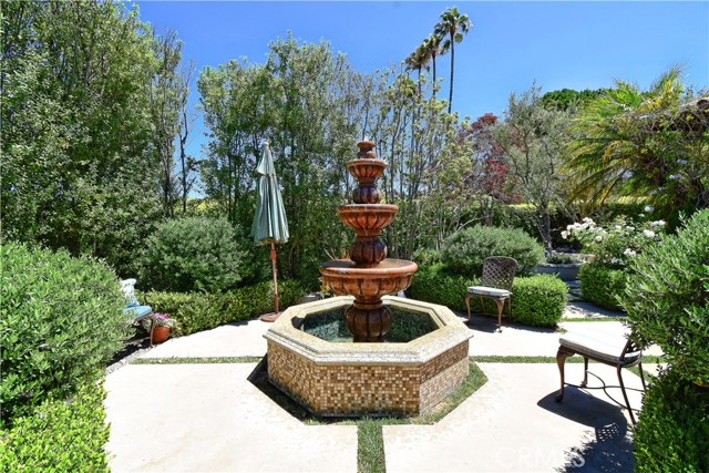 Another view of the fountain and manicured landscaping.