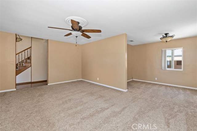 Bright and open living room area off front entry