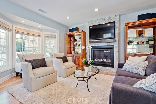 family room with new fireplace stone. Lots of natural light