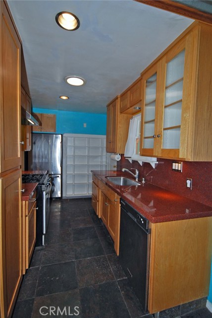 Well-appointed kitchen with large stainless sink and dishwasher too! Notice the solar tube skylight!