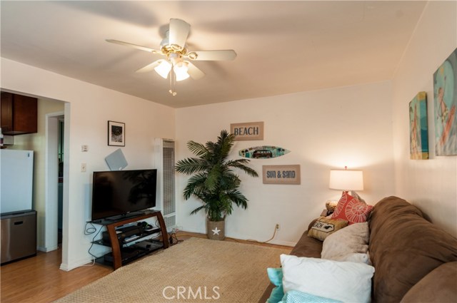 Laminate flooring and ceiling fan in Living room of unit #2.