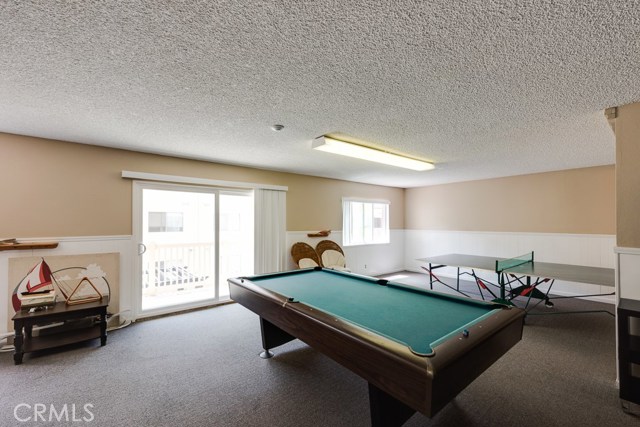 Game room w/ pool tables, ping pong table and dart board