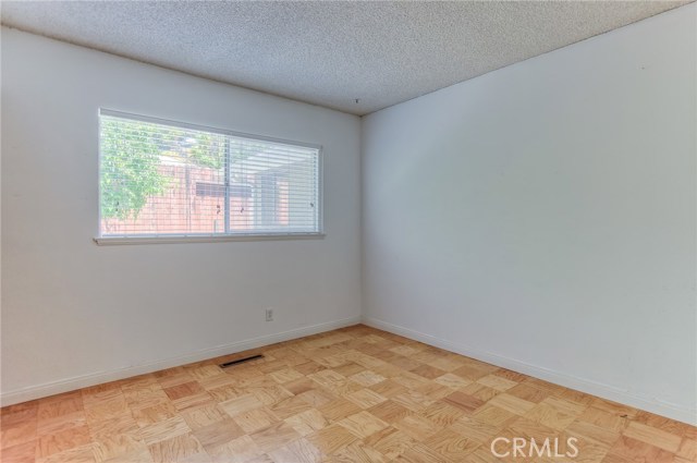 4th bedroom also with window looking towards gated sideyard